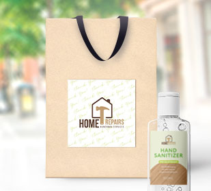 Large square sticker on a plain gift bag. Medium rectangle sticker on bottle of hand sanitizer. Small business branding using stickers.